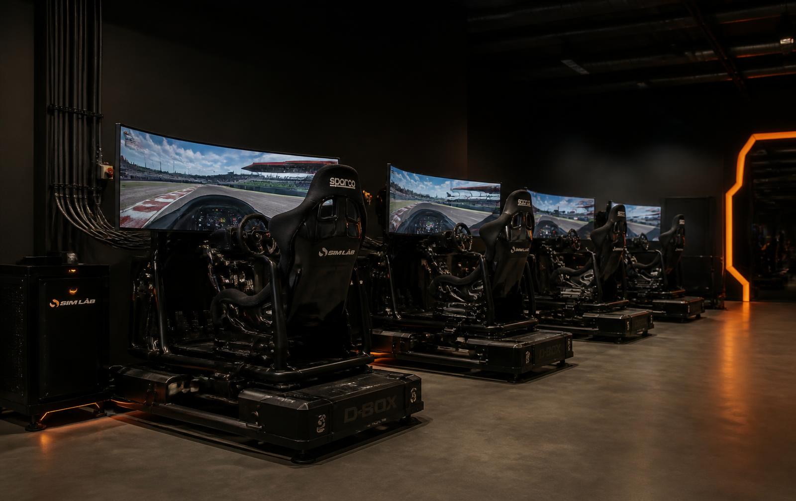 Row of commercial motion simulators at a venue
